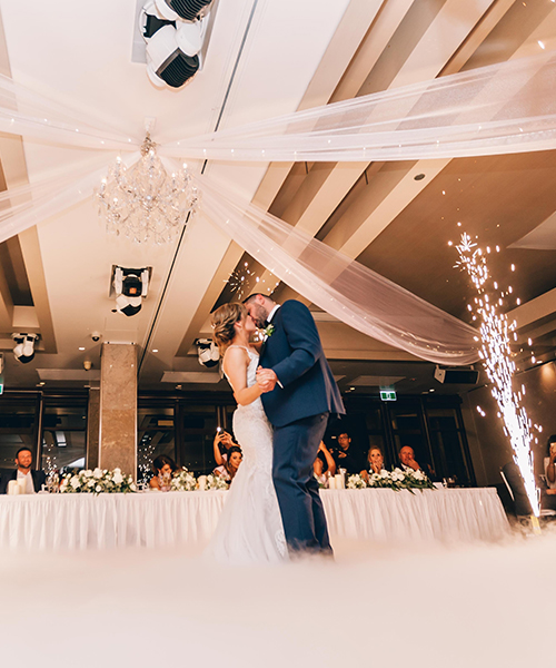 bride and groom kissing at their wedding